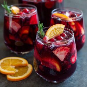 Healthy red wine sangria with antioxidant-rich fruits and low-sugar ingredients in a large glass pitcher