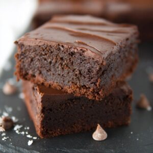 Chocolate mascarpone brownies with creamy white mascarpone swirl through dark fudgy chocolate base, topped with chocolate ganache and sea salt