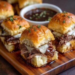 Beef brisket sliders on a wooden board, soft golden Hawaiian rolls split open and stuffed with juicy shredded smoked brisket, glossy BBQ sauce, creamy coleslaw with shredded cabbage and carrot, melted cheese, sesame seed buns topped with butter glaze