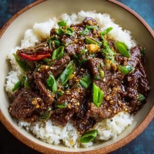 Best Mongolian beef recipe with crispy edges and glossy sauce over jasmine rice